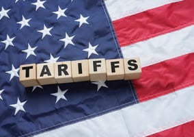 blocks spelling tariffs on american flag