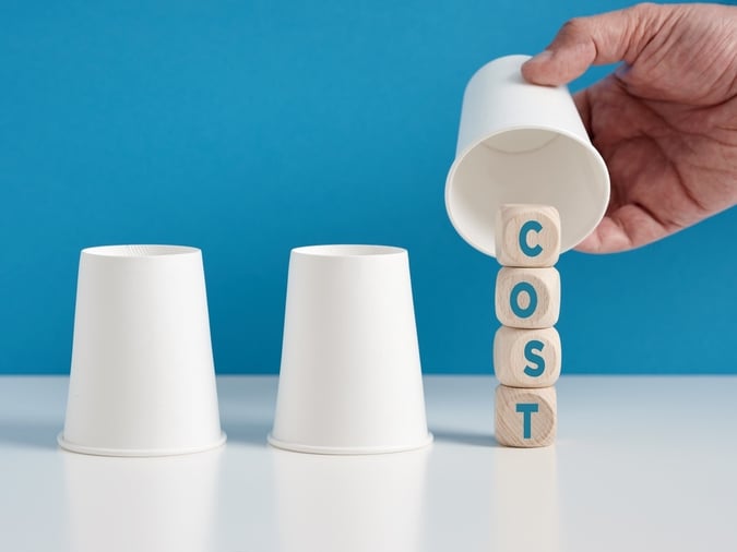lifting cup with blocks spelling cost underneath